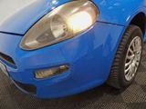 a blue car that is parked in a garage