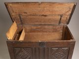 a wooden chest with two open doors on it
