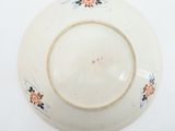 a white plate with a floral design on it