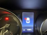 a picture of a car dashboard with a digital display on it