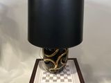 a table with a lamp on top of it on a table