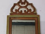 a mirror hanging on the wall in a bathroom