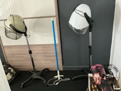 a photo of a room with a lamp, a book, and a pair of shoes