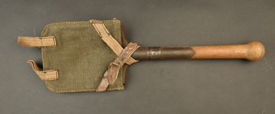 an old baseball bat with a wooden handle on a table