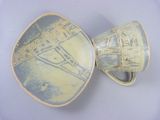 a cup and a saucer sitting on a plate
