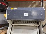 a machine that is sitting on a pallet in a garage