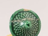 a picture of a ring with a green design on it