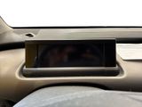 a close up of a car dashboard with a cell phone in it