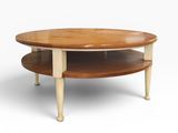 an image of a round coffee table with two shelves