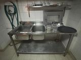 an image of a kitchen with a sink and a stove