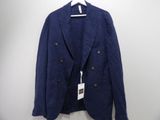 a blue jacket hanging on a hanger on a white wall