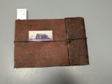 an old photo album with a picture of a horse on it