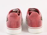 the pink sneakers are on a white surface with a white background