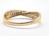 a close up of a gold ring on a white surface