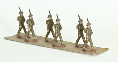 three figurines of men in military uniforms walking on a board