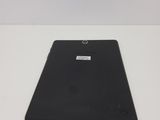 the back of a black tablet computer sitting on top of a white table
