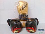 pair of boxing gloves sitting on top of each other on a table