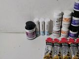 many different types of pills and vitamins on the counter