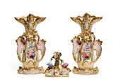 two vases that are decorated with flowers on them