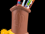 a brown boot with pens and markers in it