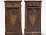 pair of antique wooden nightstands with a carved heart on the front