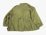 the jacket is green and has buttons on the collar