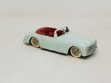 a toy car that is sitting on a white surface