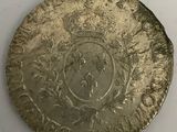 an old silver coin with a crown on it