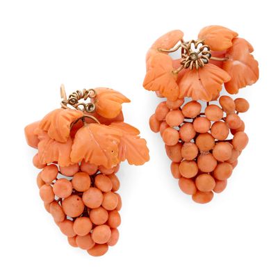 une image représentant une grappe de raisins de couleur corail sur fond blanc