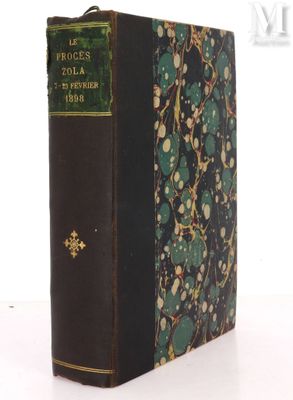 an old book sitting on top of a white table next to a white wall