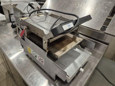 a machine that is sitting on a table in a kitchen