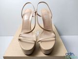 the woman ' s shoes are on the box on the table