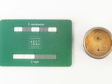 an image of a green card and a coin