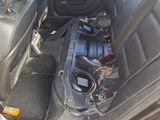 the back seat of a car with a bunch of electronics in it