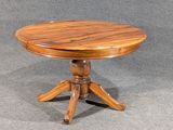 a small wooden table with a wooden top on a grey background