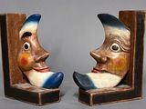two bookends that have faces on them