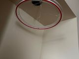 a red telephone in the corner of a room