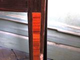 a close up of a wooden table with a clock on it