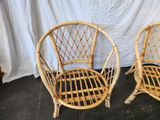 pair of wicker chairs in the shape of a peacock egg