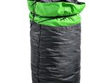 a black and green sleeping bag sitting on top of a white floor