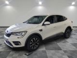 a white suv is parked in a room with checkered flooring