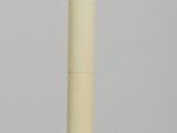 a small white object on a wooden table