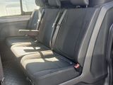 the back seats of a van with the door open