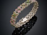 a bracelet with multi colored stones on a black background