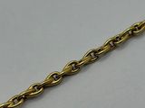 a close up of a chain on a white surface