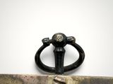 a ring that is sitting on top of a piece of metal
