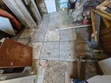 an image of a room that has a lot of stuff on the floor