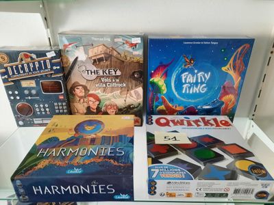 many board games on display on a glass shelf