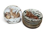 quatre assiettes sur lesquelles figurent l'image d'un écureuil et un écureuil