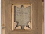 an old picture of a piece of cardboard with a piece of wood sticking out of it